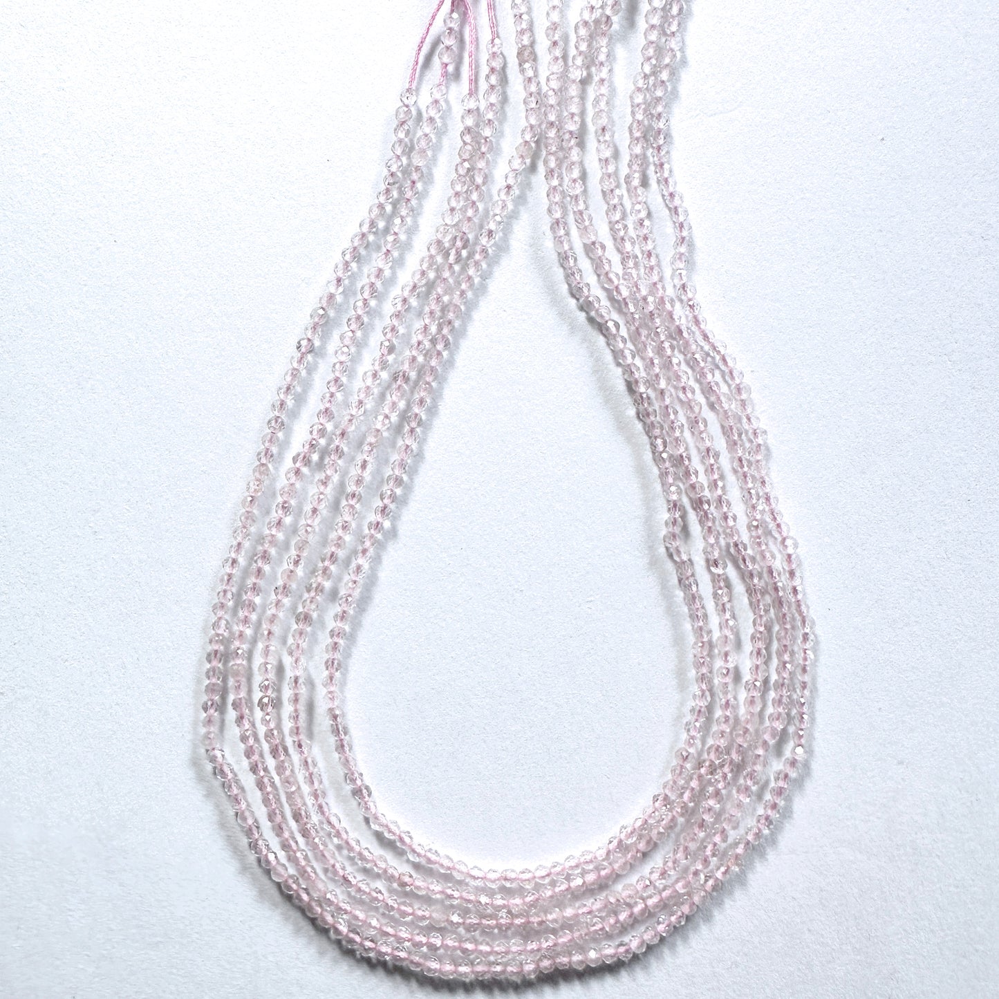 Premium Rose Quartz rondelle beads with subtle sparkle and calming pink hue.
