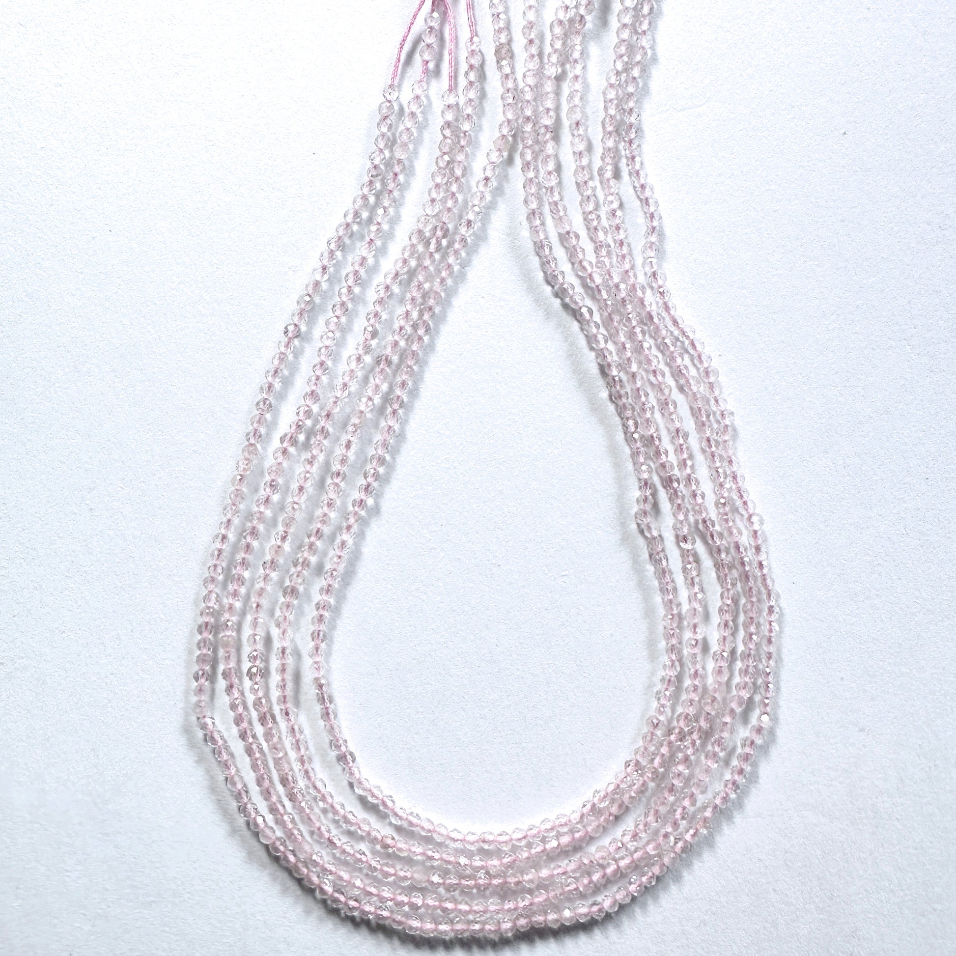 Premium Rose Quartz rondelle beads with subtle sparkle and calming pink hue.