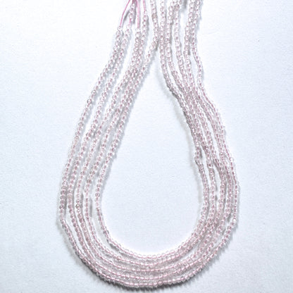 Premium Rose Quartz rondelle beads with subtle sparkle and calming pink hue.