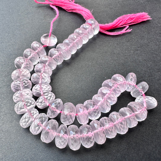 Close-up of Rose Quartz stone beads showing micro faceted cut and natural gemstone sparkle.