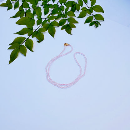 Rose Quartz necklace with faceted rondelle beads in soft pink tones.
