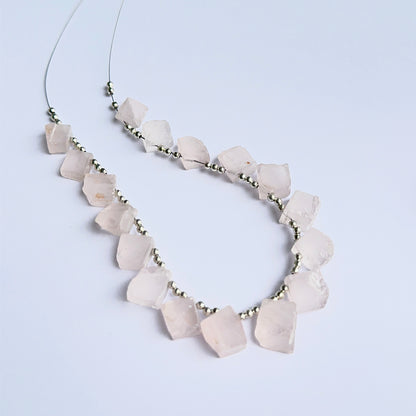 Rose quartz rough stones arranged neatly to showcase natural gemstone quality and handcrafted appeal.