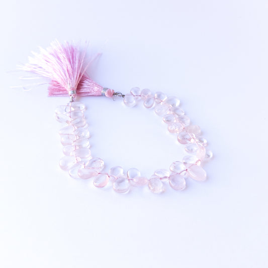 Genuine stone beads in soft pink hues, featuring smooth briolettes for DIY jewellery making.