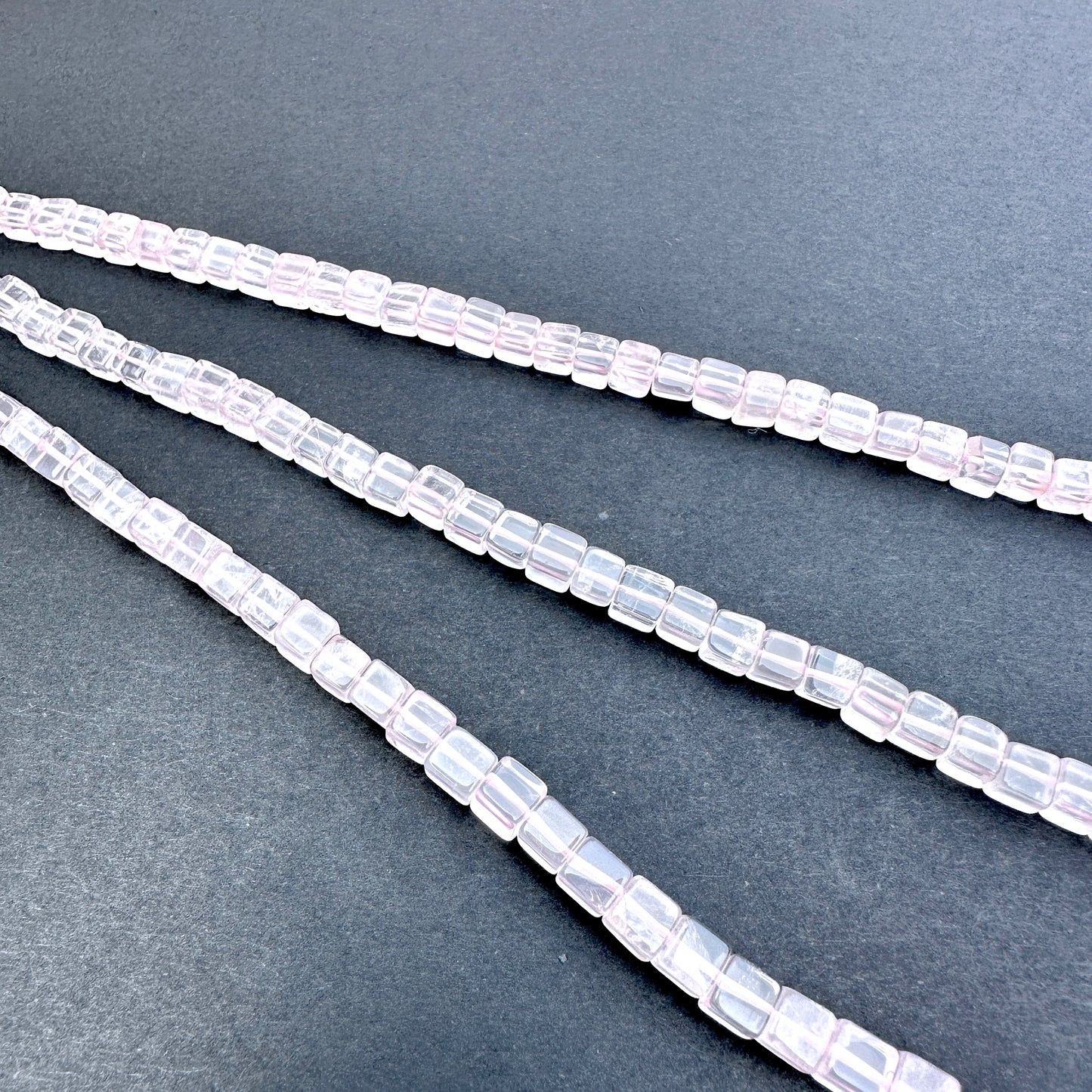 Rose Quartz stone beads with smooth square cut and gentle pastel hue.