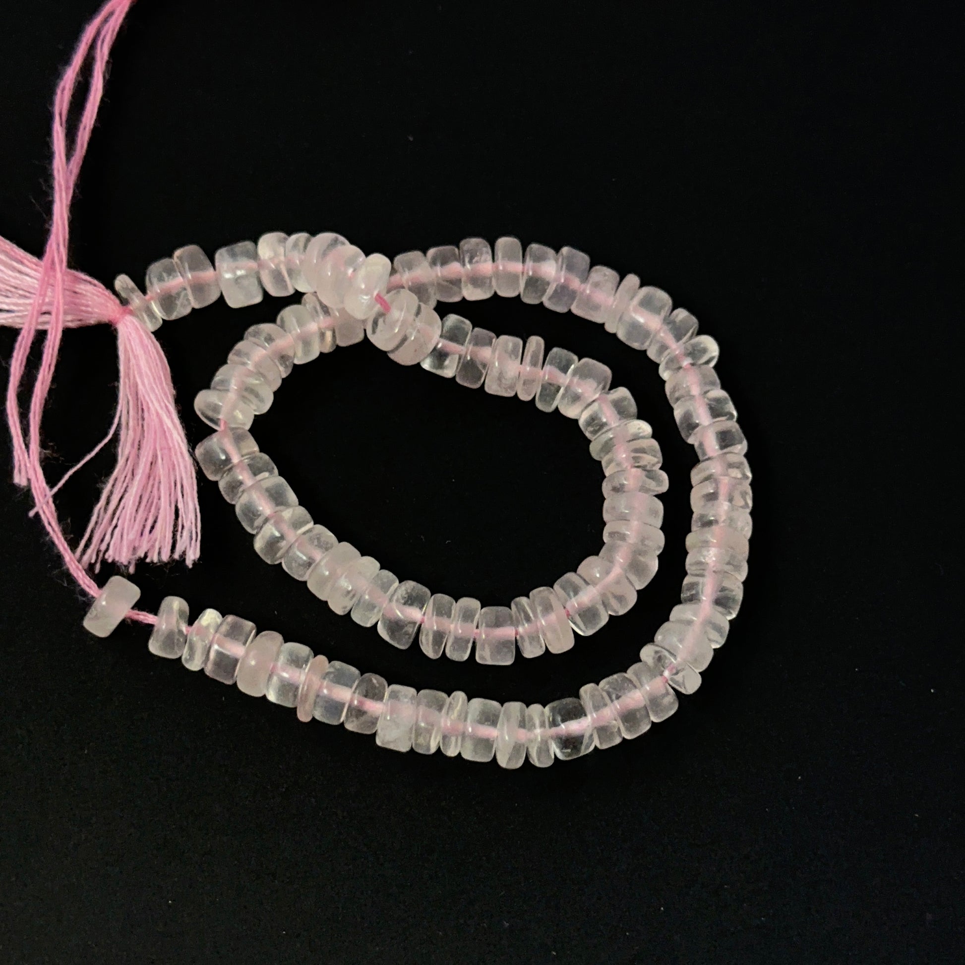 Soft pink Rose Quartz wheel‑cut beads with gentle shine, perfect for genuine gemstone beads in creative designs.
