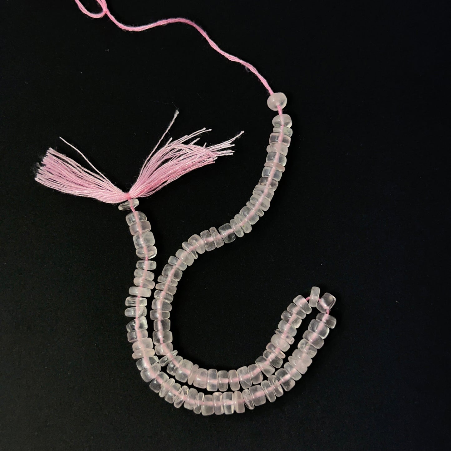 Rose Quartz smooth wheel beads in soft pink tones, showcasing 5mm stone beads ideal for DIY jewellery.