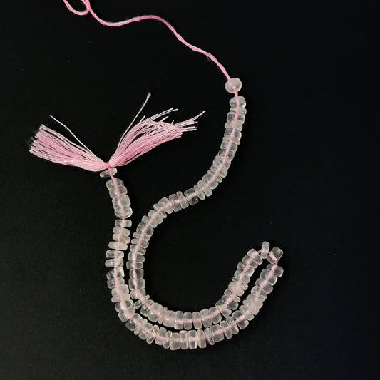 Rose Quartz smooth wheel beads in soft pink tones, showcasing 5mm stone beads ideal for DIY jewellery.