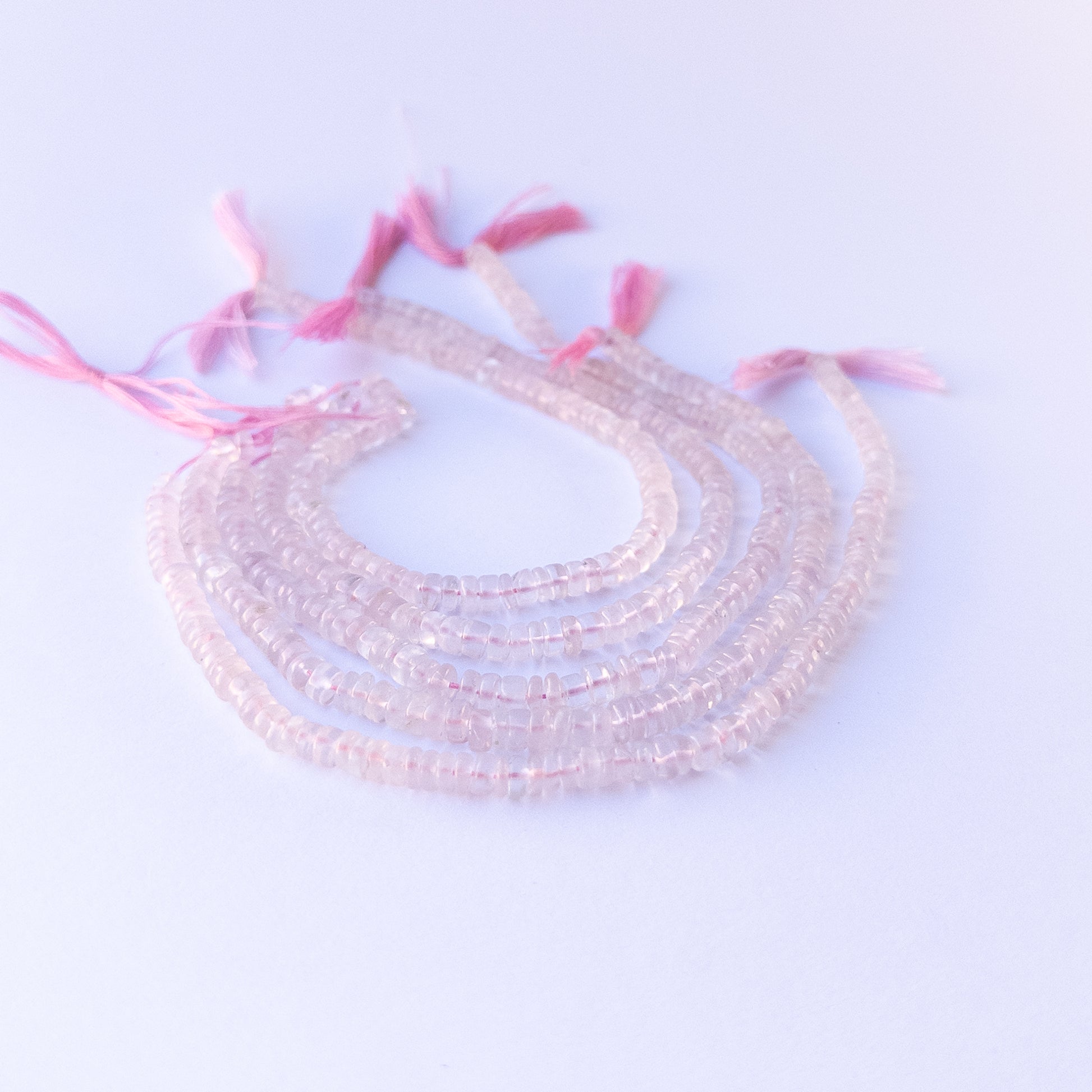High‑quality rose quartz wheel gemstone beads with gentle shine and natural pastel colour variation.