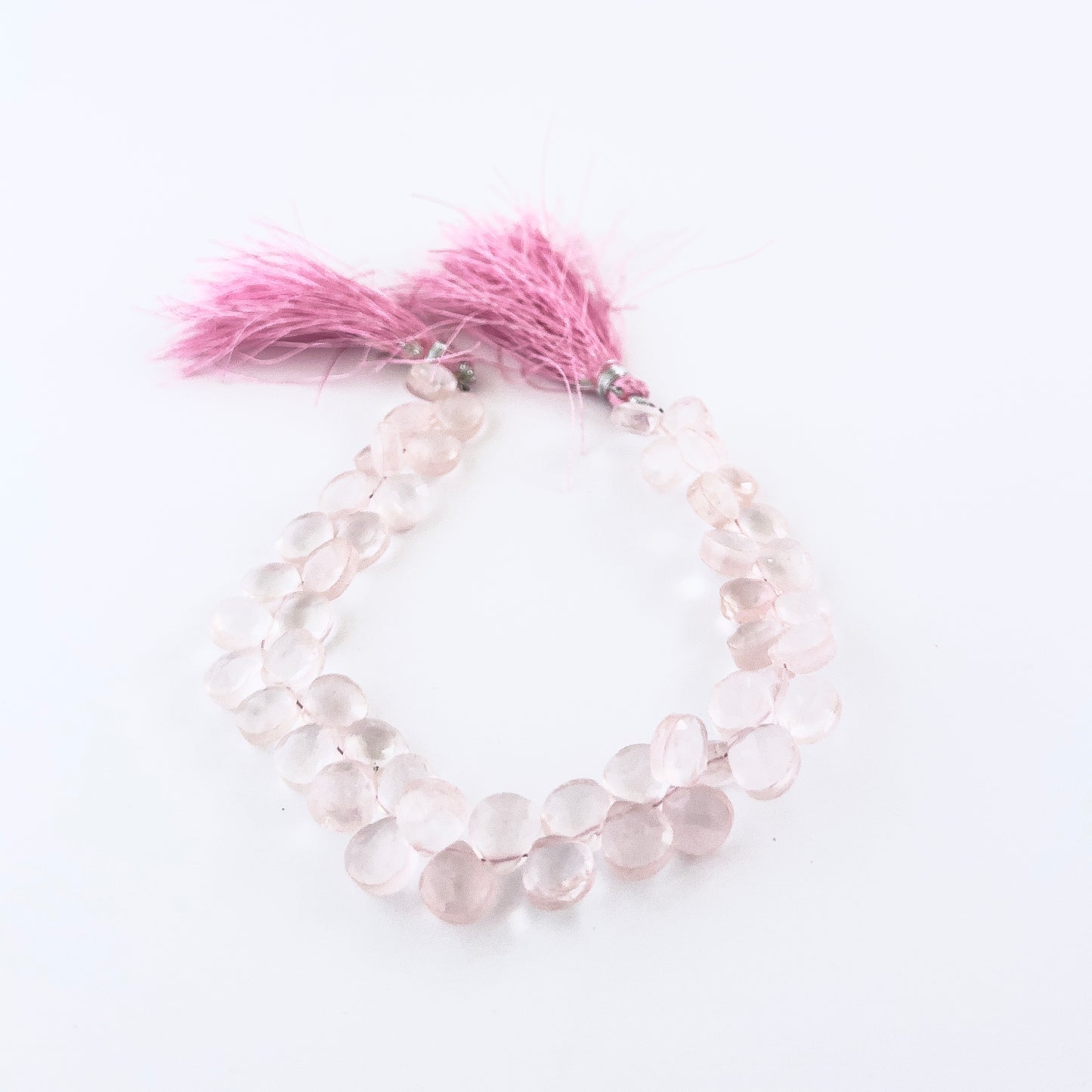Rose Quartz faceted briolette gemstones with gentle blush colour and polished brilliance in a 20cm strand.