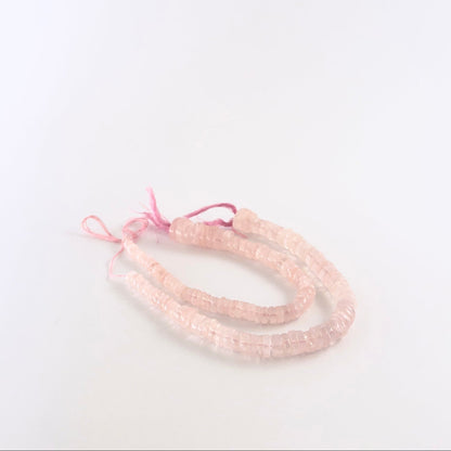Rose Quartz smooth wheel gemstones with rounded shaping and gentle blush colour across a 19cm strand.