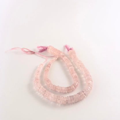 Rose Quartz smooth wheel beads sized 5.5–12mm arranged in a 19cm strand, showing soft pink tones and a polished finish.