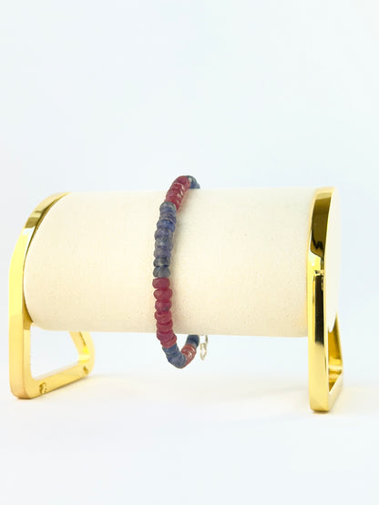 Ruby and blue sapphire bead bracelet arranged in a single adjustable strand.
