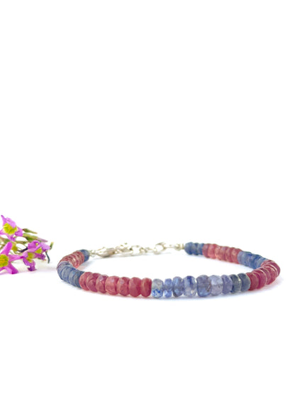 Elegant ruby and blue sapphire bracelet crafted with faceted rondelle beads.