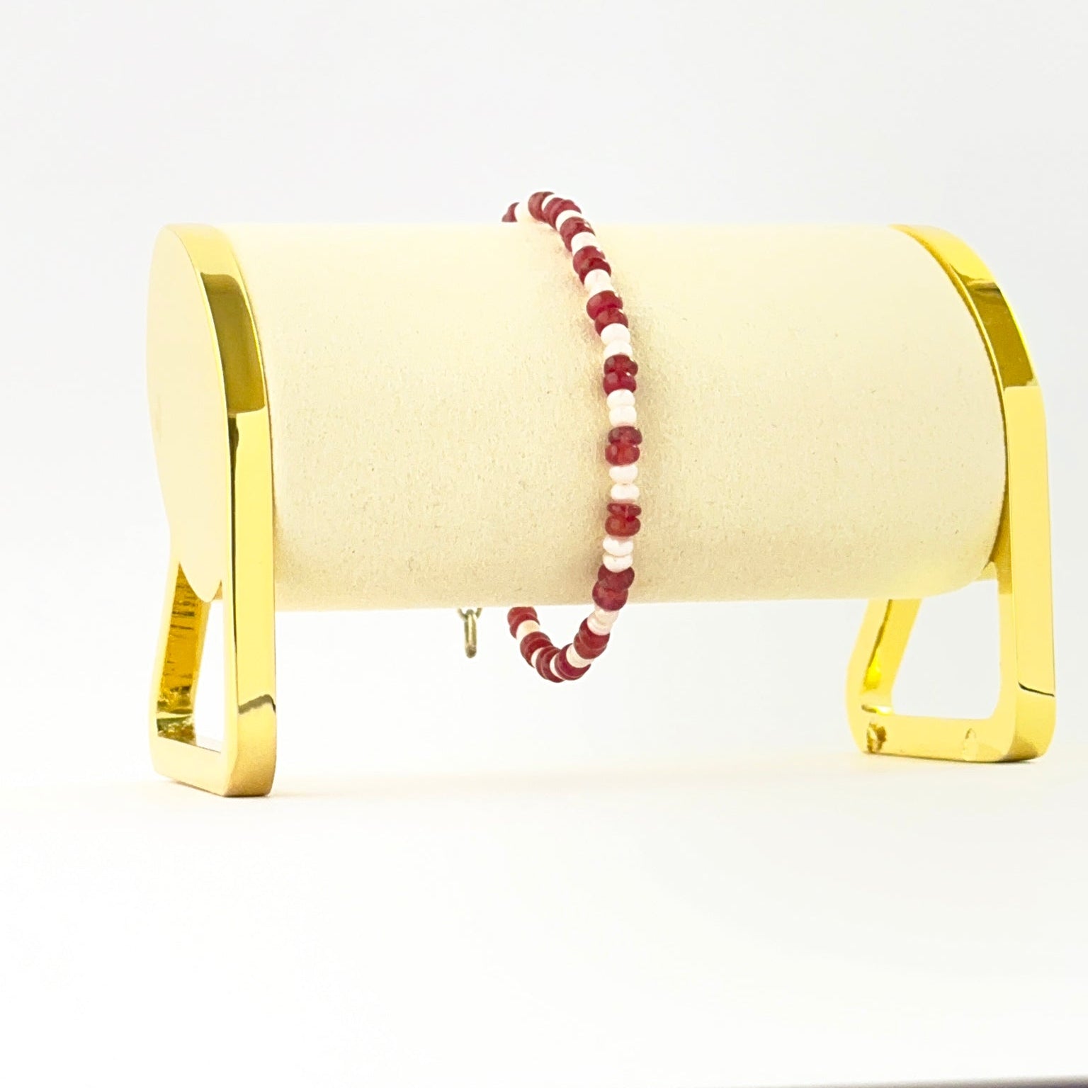 Single‑strand bracelet featuring smooth rondelle ruby and freshwater pearl beads sized 3.7–4mm in an 18cm adjustable design.