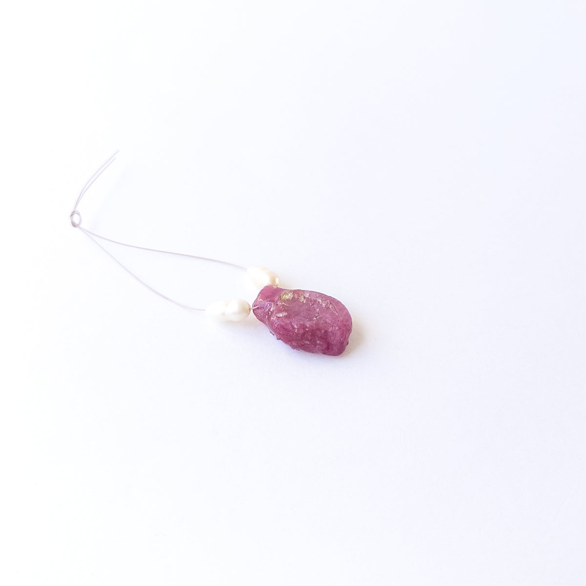 Ruby and Freshwater Pearl rough‑drilled beads showing natural texture and rich red‑white contrast in a 3‑piece set.