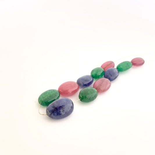 Mixed precious gemstone ovals displayed with glossy surfaces ideal for handmade jewellery components.