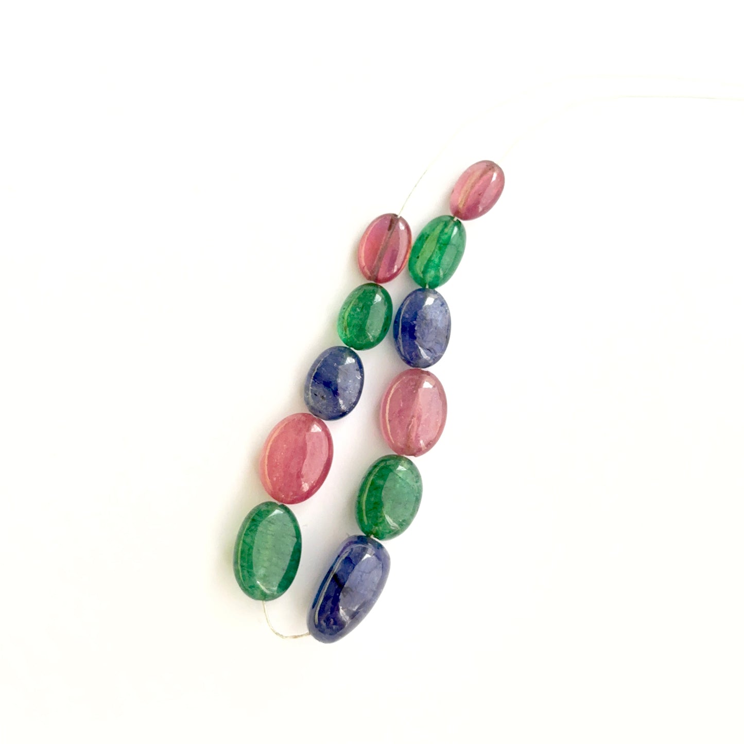 Multi precious smooth oval beads photographed to show clarity, colour and gemstone beauty.