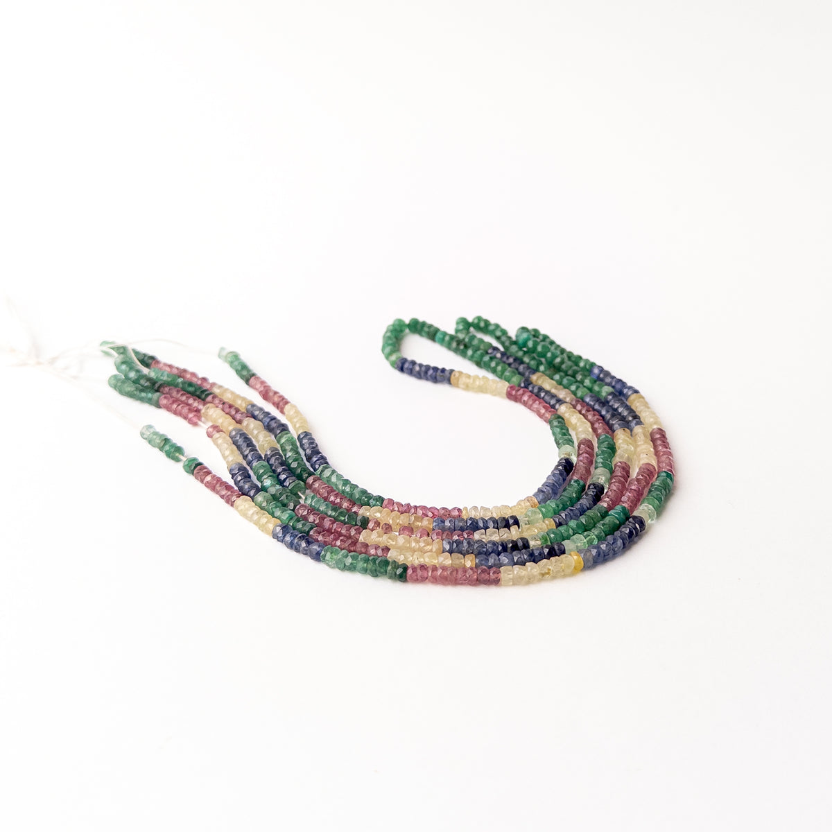 Genuine multi precious gemstone beads arranged on a 41cm strand with rich red blue yellow and green colour variations.