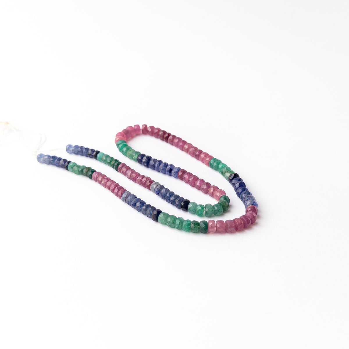 Genuine Ruby Sapphire Emerald gemstone beads arranged on a 42cm strand with sparkling faceted rondelle finish.