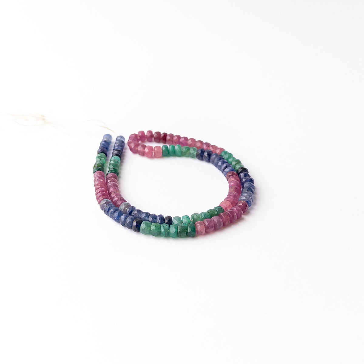 Multi Precious Ruby Blue Sapphire and Emerald faceted rondelle gemstone beads strand with vibrant red blue and green colours, 143 carats.