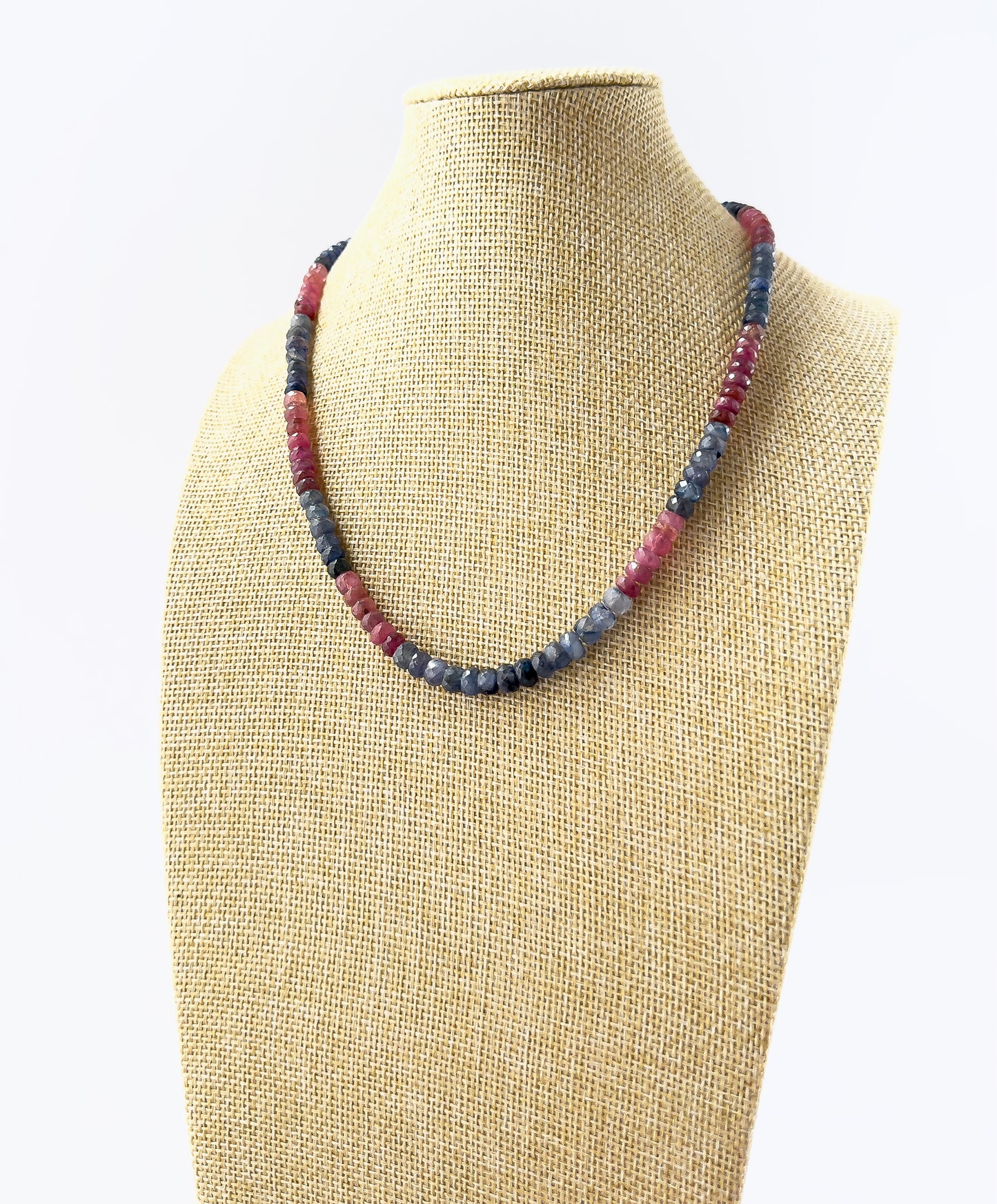 Genuine Ruby and Blue Sapphire faceted rondelle beads showcasing brilliant sparkle and rich colour in a 220‑carat necklace.