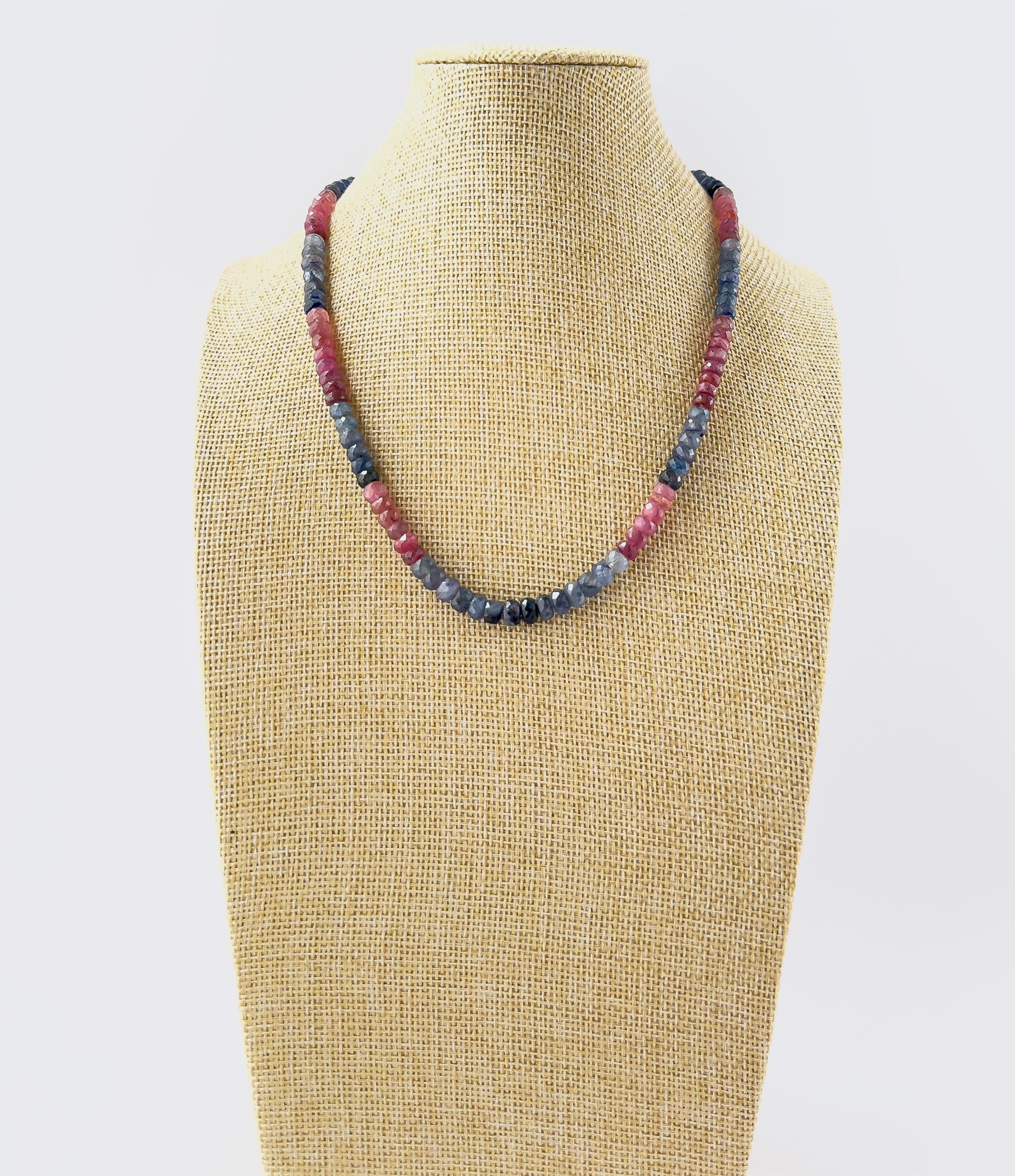 Ruby and Blue Sapphire faceted rondelle necklace featuring 6–6.2mm beads in a 48cm adjustable strand with vibrant red‑blue contrast.