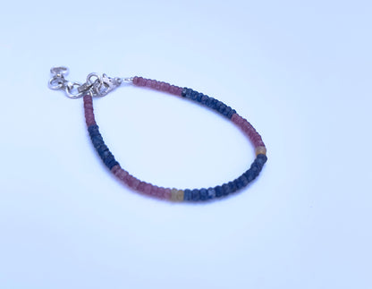 Handcrafted gemstone bracelet showcasing sparkling faceted rondelle beads in a colourful arrangement.