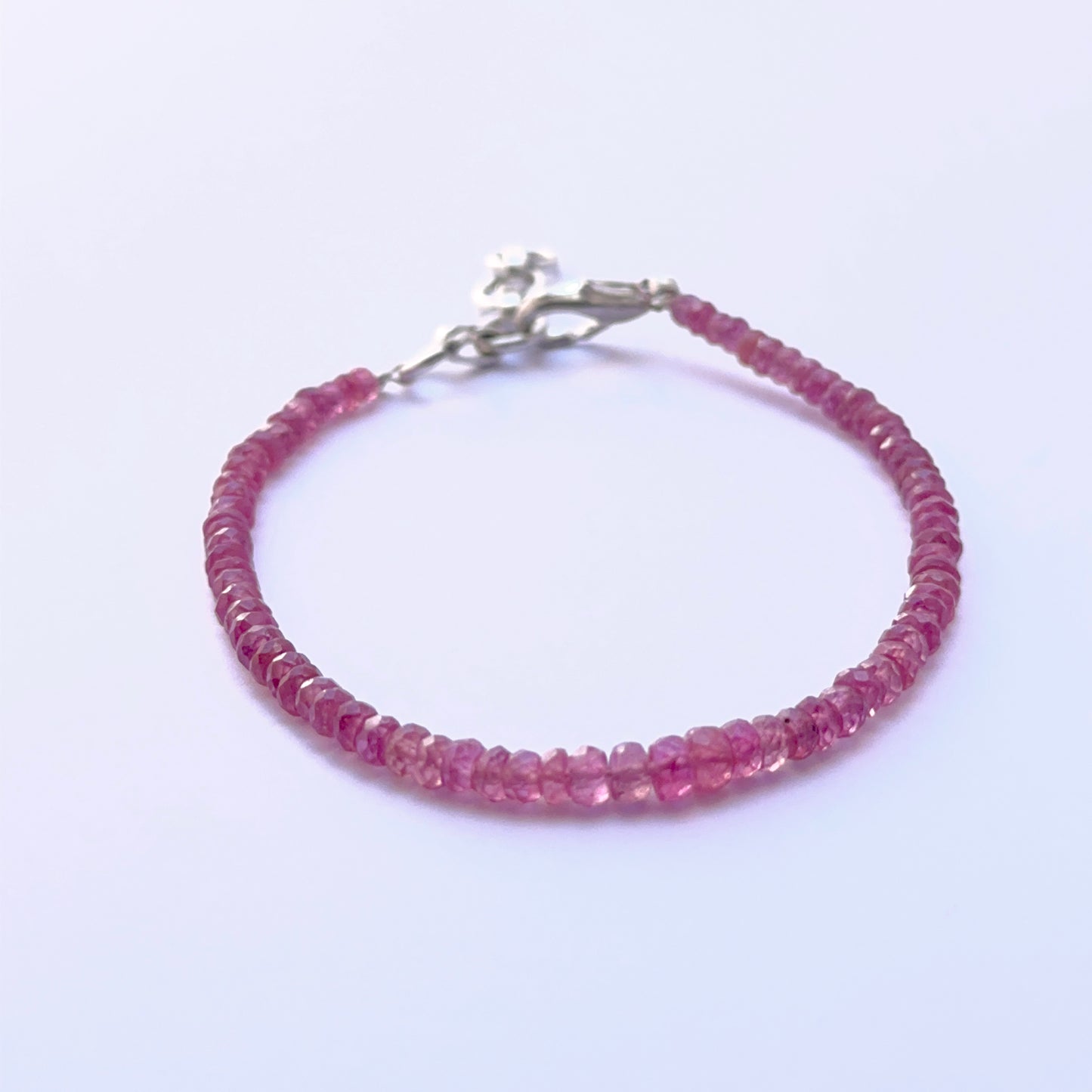 Elegant ruby bracelet featuring faceted beads in a refined layout.