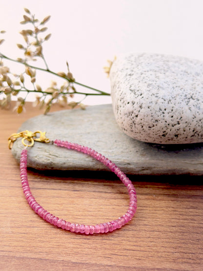 Ruby bracelet with sparkling rondelle beads showing shine.