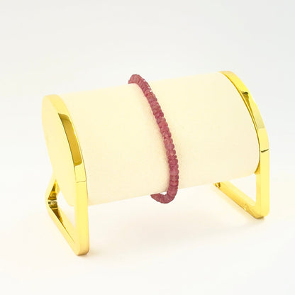Elegant faceted rondelle ruby bracelet crafted in a single adjustable strand.