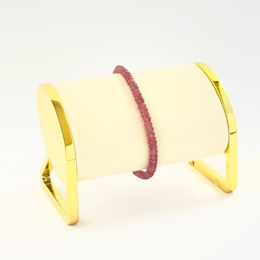 Elegant faceted rondelle ruby bracelet crafted in a single adjustable strand.