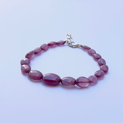 Elegant ruby bracelet featuring smooth polished beads in a refined layout.