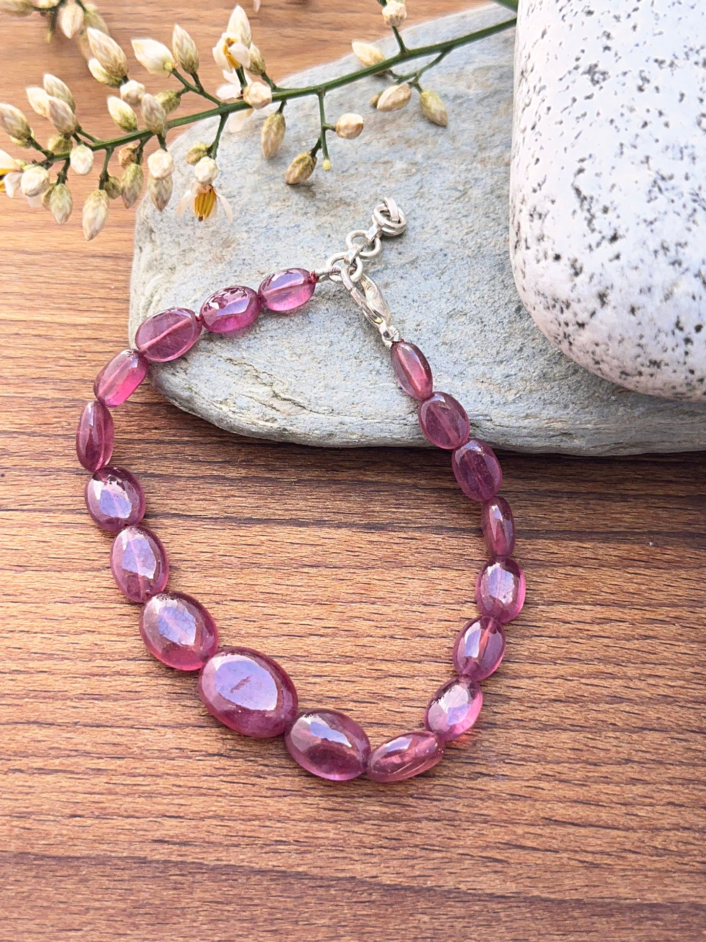 Ruby bracelet with oval beads showing rich colour and shine.