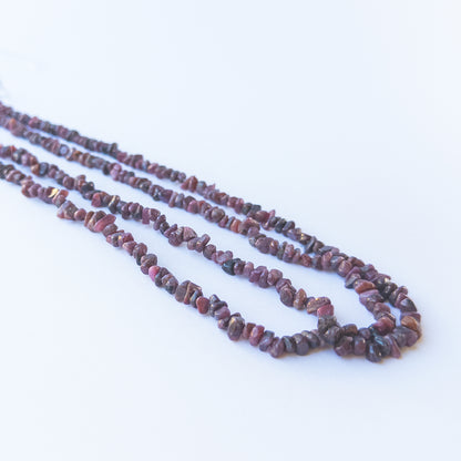 Ruby chip beads showcasing natural shine and varied shapes for gemstone bead creators.