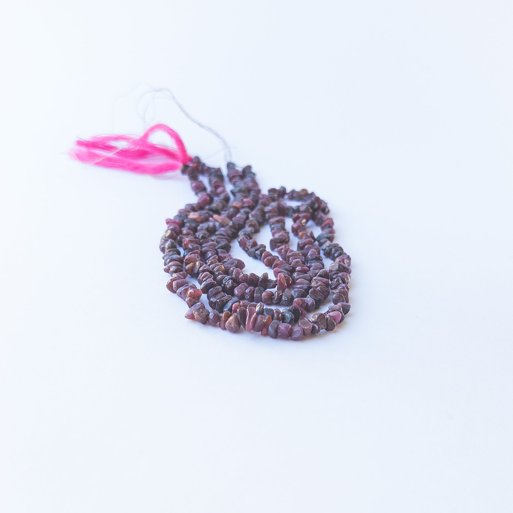 Ruby chip beads displaying natural colour variation and premium craftsmanship.