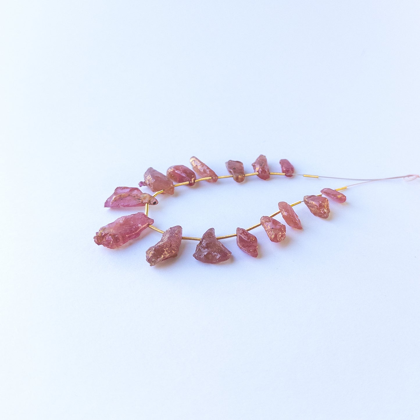 Genuine ruby stone beads with natural rough texture and drilled finish, ideal for DIY jewellery and artisan beadwork. 
