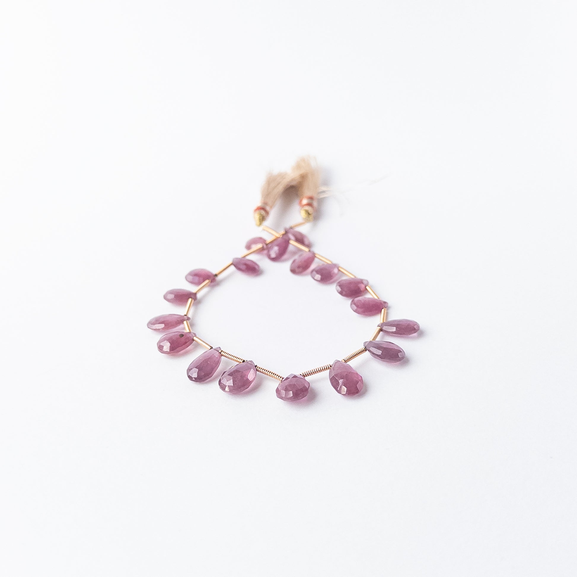 Ruby faceted briolette beads in rich red tones, genuine gemstone beads with brilliant sparkle.