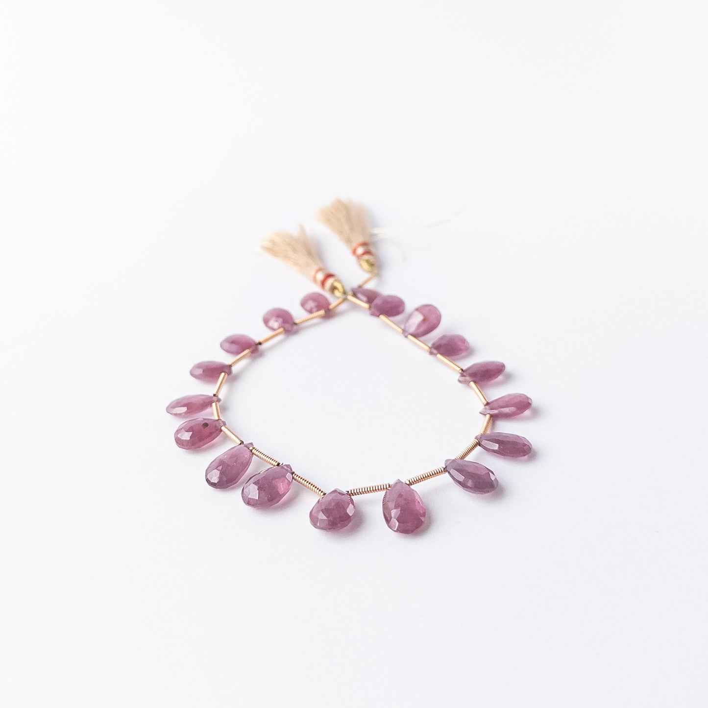 Genuine Ruby gemstone beads, 18 pieces totalling 55 carats, showcasing vivid colour and fine clarity.