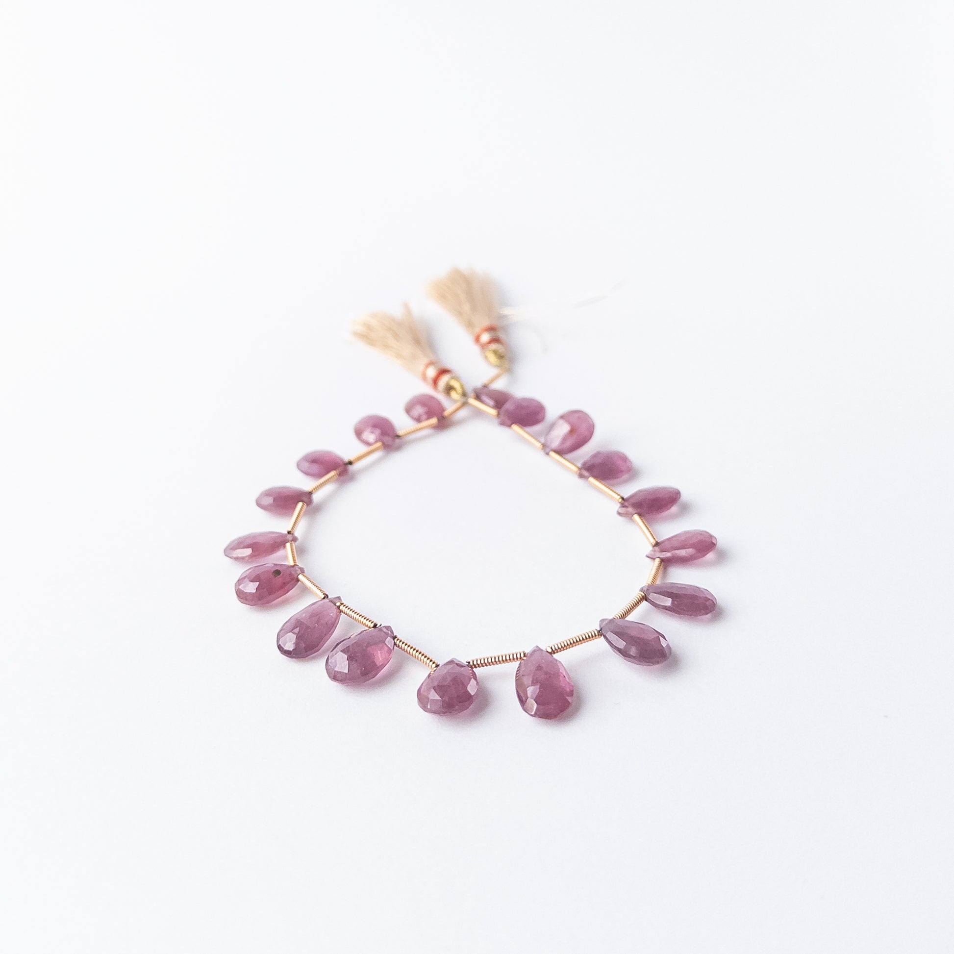 Genuine Ruby gemstone beads, 18 pieces totalling 55 carats, showcasing vivid colour and fine clarity.