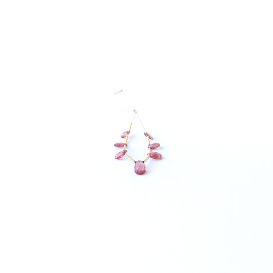 Close‑up of genuine Ruby faceted briolette stone beads showing polished facets and natural gemstone shine.