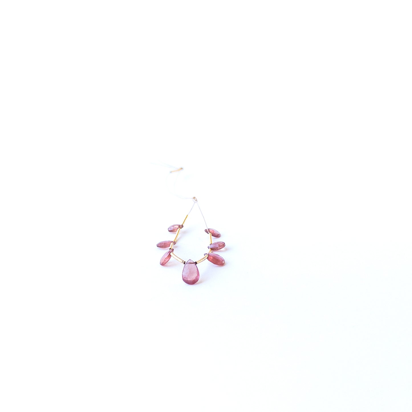 Ruby faceted briolette beads displaying rich red colour and high‑quality craftsmanship for artisan jewellery.