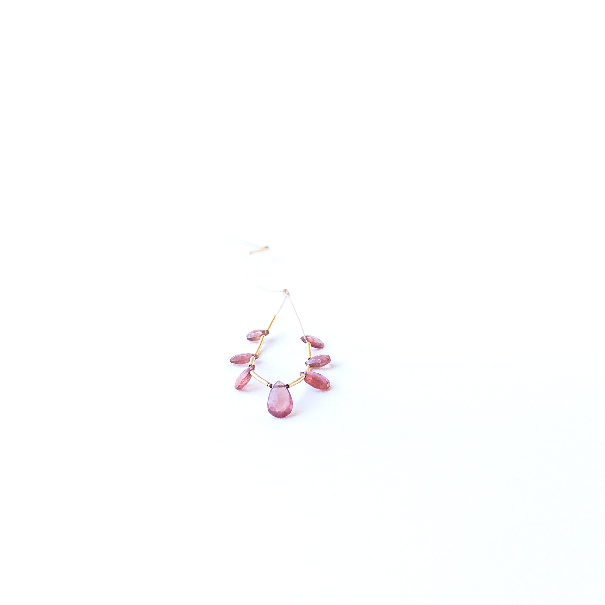Ruby faceted briolette beads displaying rich red colour and high‑quality craftsmanship for artisan jewellery.