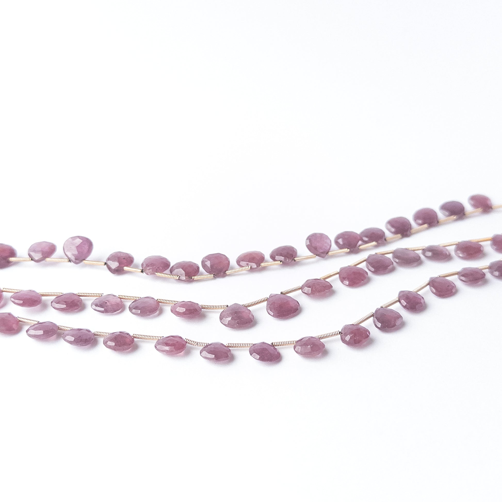Ruby faceted briolette beads sized 8–9.3mm, high‑quality gemstone beads suited for elegant handmade jewellery creations.