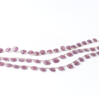 Ruby faceted briolette beads sized 8–9.3mm, high‑quality gemstone beads suited for elegant handmade jewellery creations.