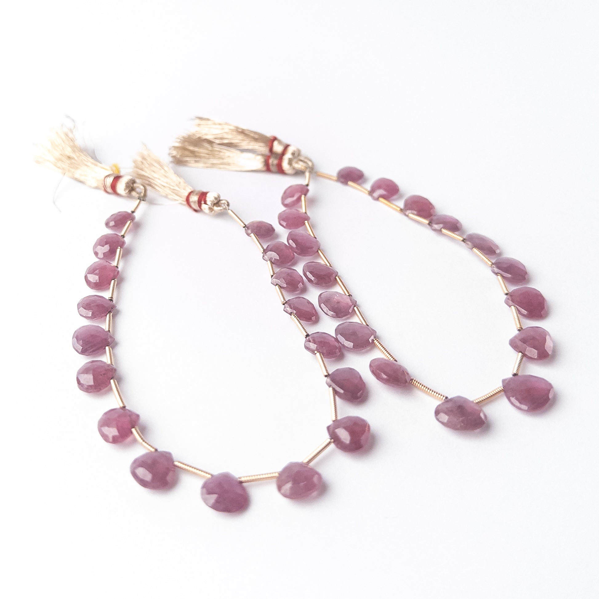 Authentic Ruby stone beads with sparkling faceted briolette cut, arranged as 17 pieces for DIY jewellery making.
