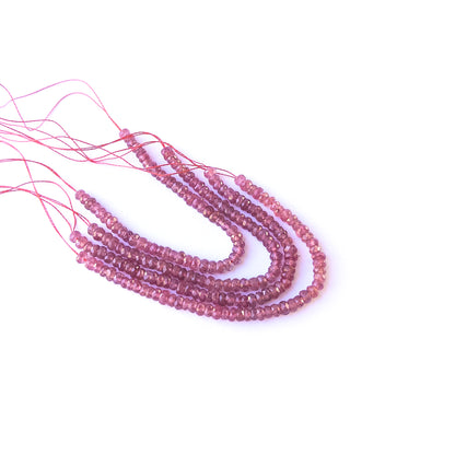 Authentic ruby stone beads in fine faceted rondelle cuts showing polished shine for jewellery design work.