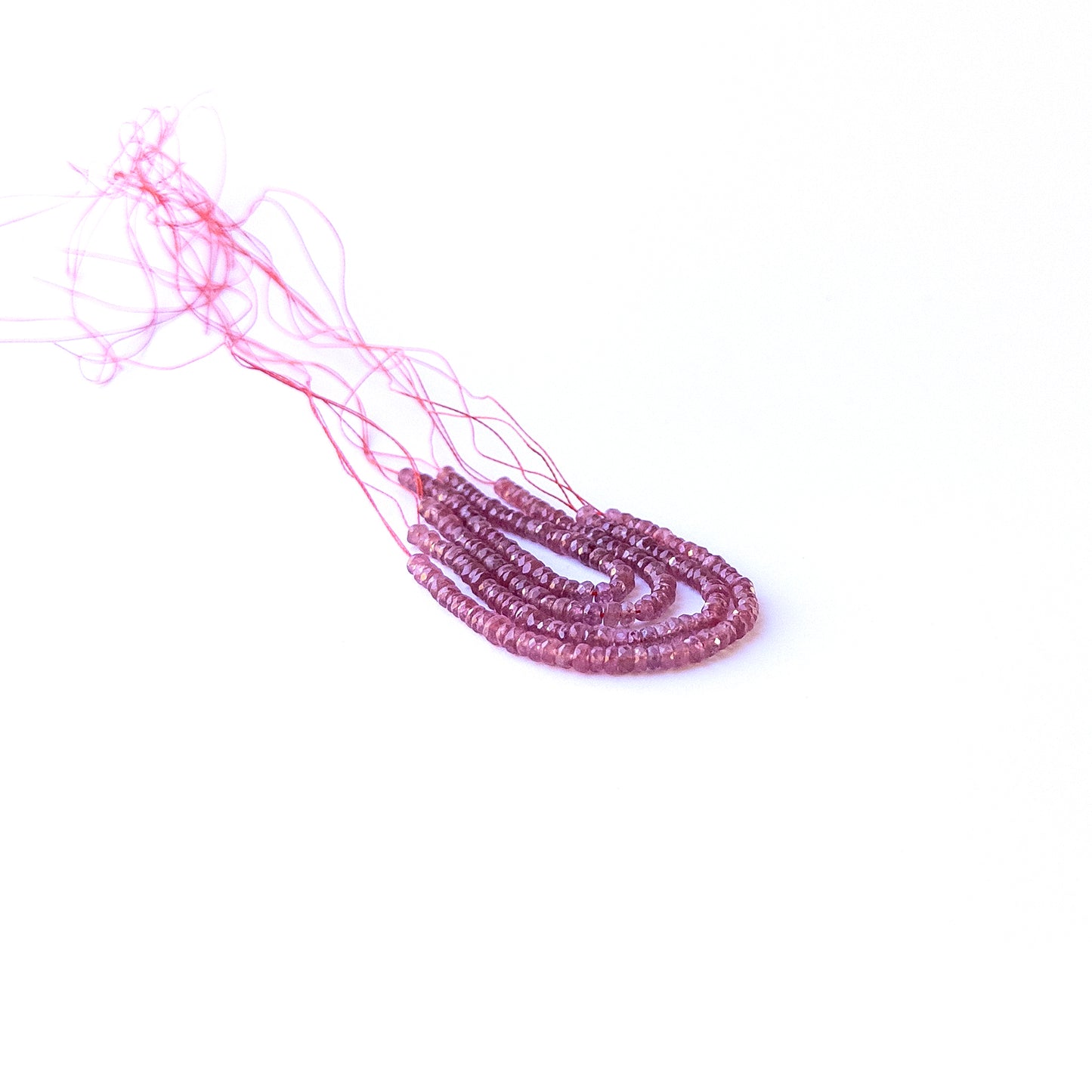 Strand of ruby faceted rondelles displaying rich red colour and quality cut for gemstone beads for DIY jewellery.