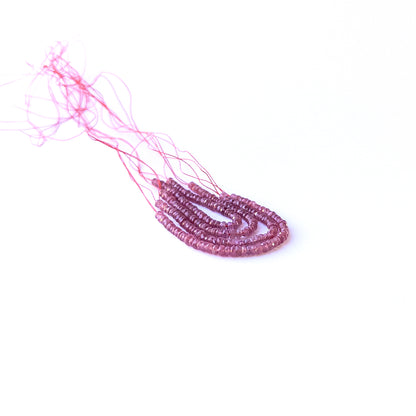Strand of ruby faceted rondelles displaying rich red colour and quality cut for gemstone beads for DIY jewellery.