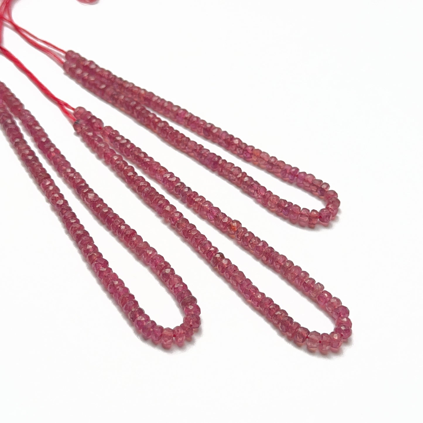 Ruby faceted rondelle beads with vivid red colour and sparkling cuts, ideal gemstone beads for DIY jewellery.