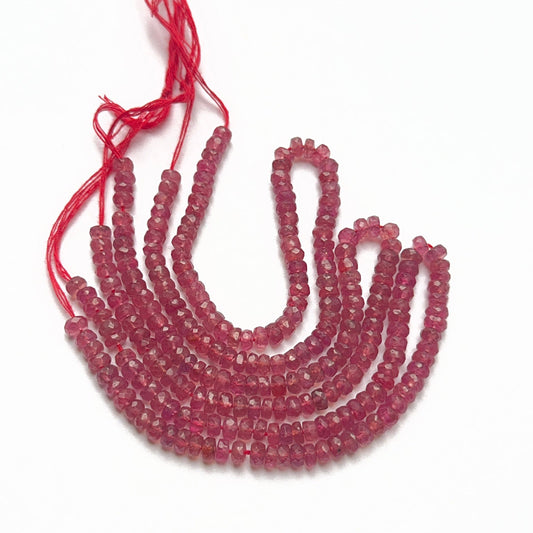 Deep red ruby rondelle beads arranged in a 20cm strand, perfect gemstone beads for elegant jewellery designs.
